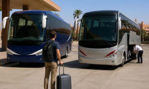 Two modern intercity coaches at a Moroccan bus terminal