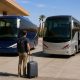 Two modern intercity coaches at a Moroccan bus terminal