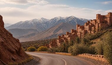 Road through the Atlas Mountains toward a traditional Moroccan kasbah