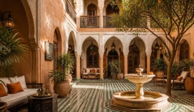 Traditional riad courtyard with zellige and orange tree in Marrakech